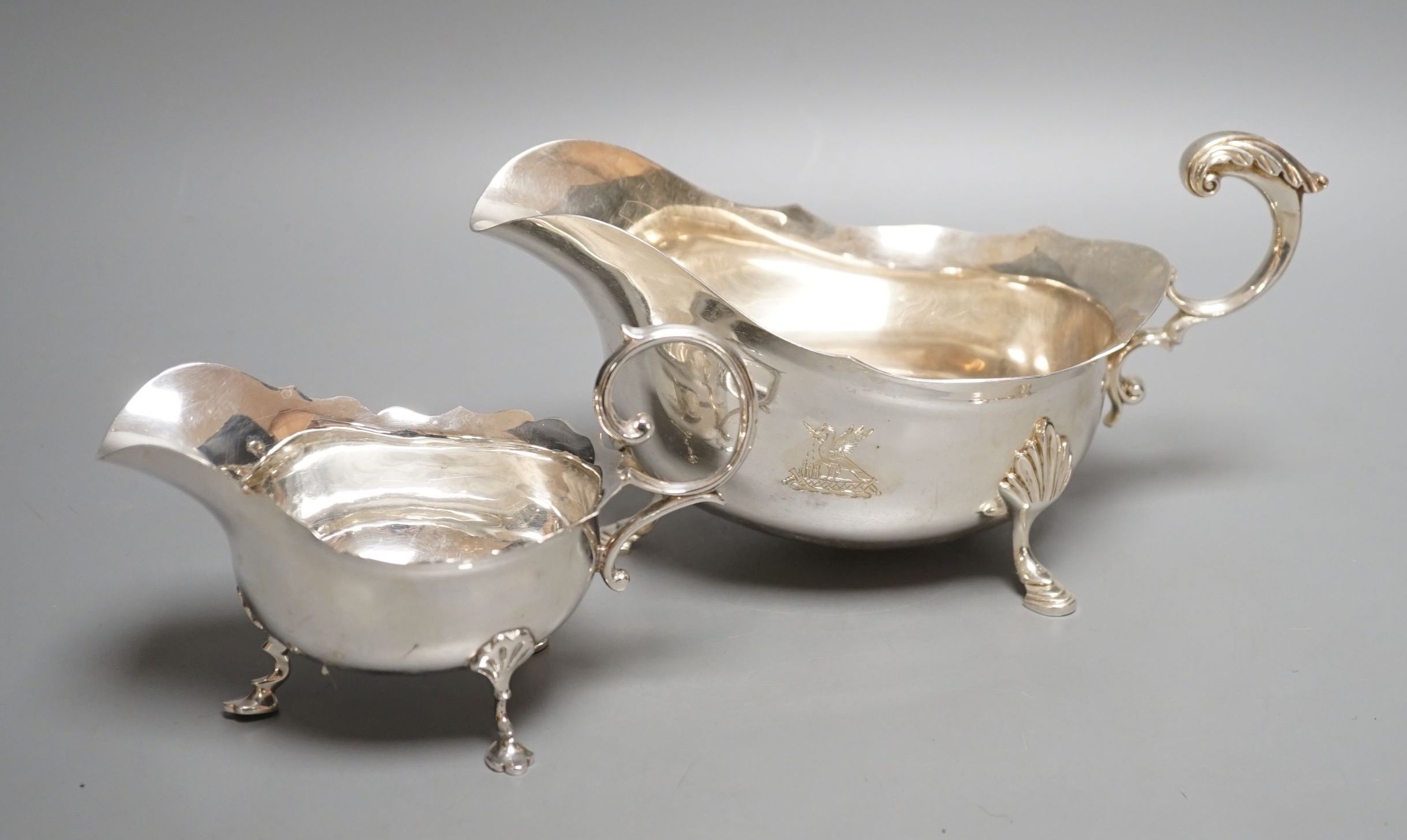 A modern silver sauceboat by Roberts & Belk and a smaller earlier silver sauceboat, 14.5oz.